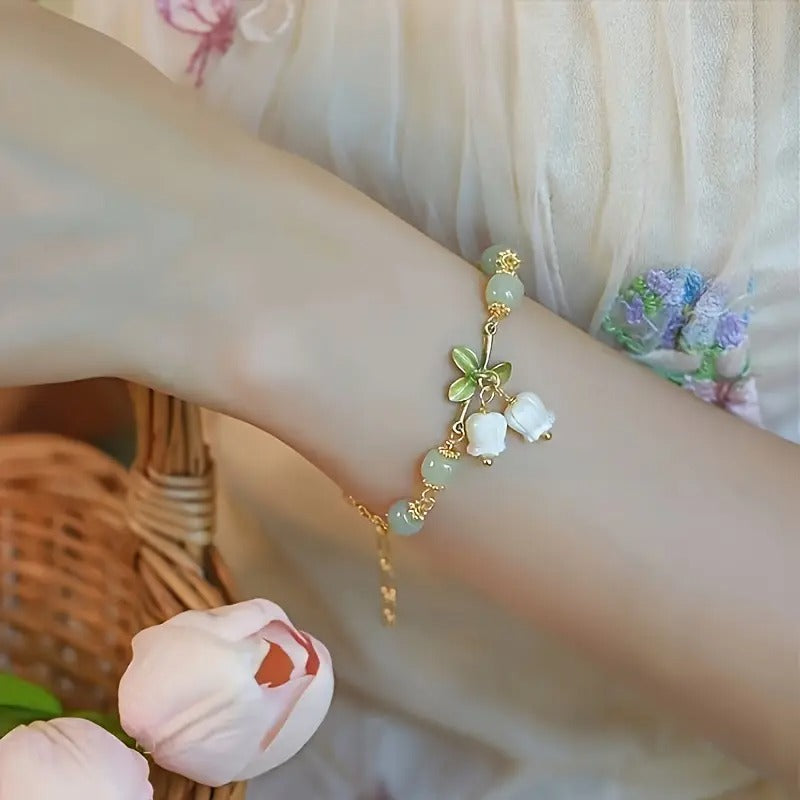 Elegant Green Beaded Bracelet with Lily of the Valley Charms